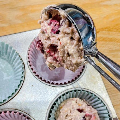 Chocolate and Cranberry muffins scoop of muffin mixture