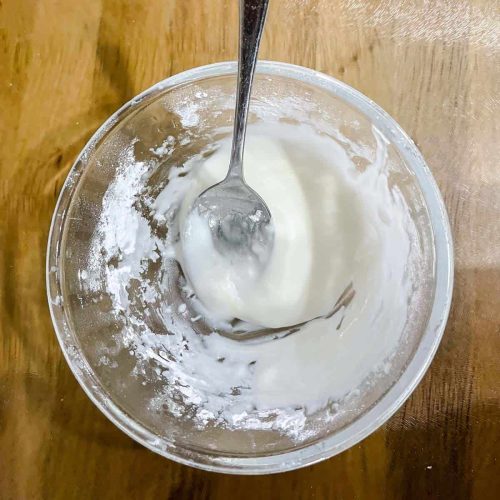 bowl of icing sugr with lemon juice