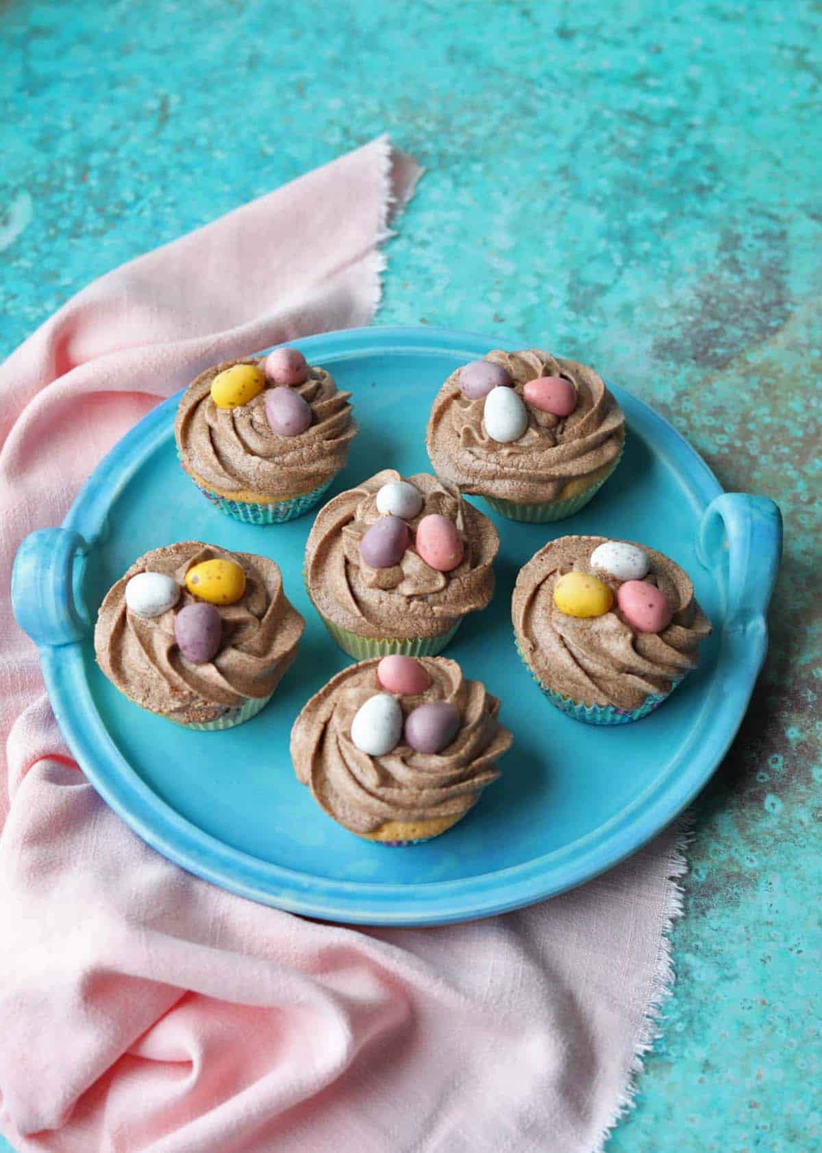 Easy Easter Nest Cupcakes on platter with cloth