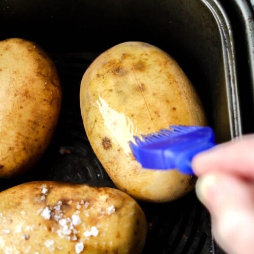 Air Fryer Baked Potatoes brush with oil
