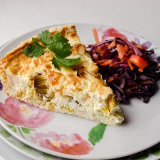 Slice of Leek & Cheese tart with coleslaw