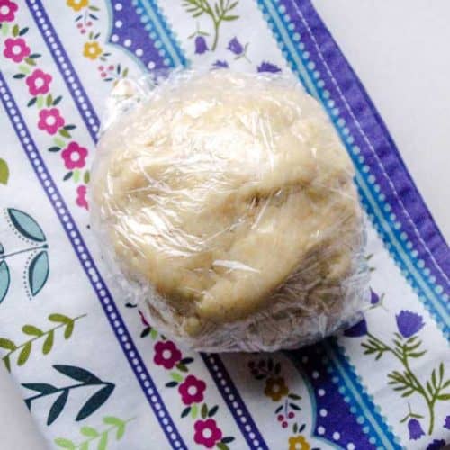 Ball of pastry in cling wrap