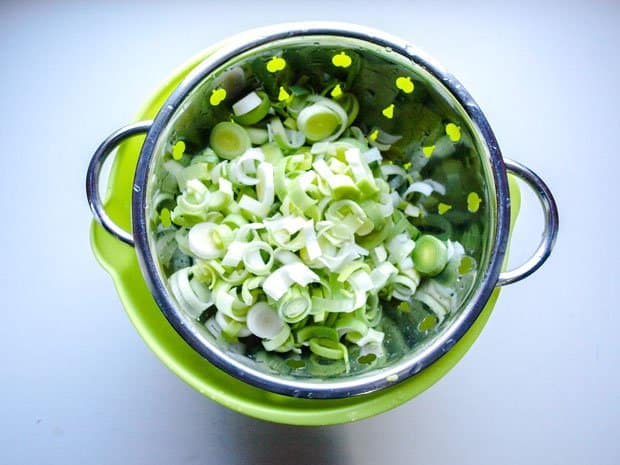 sliced leeks in colander