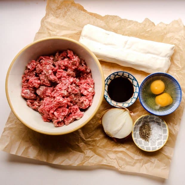 Minced beef, eggs, onion, puff pastry and seasonaing for Scottish Mince Beef Pie 