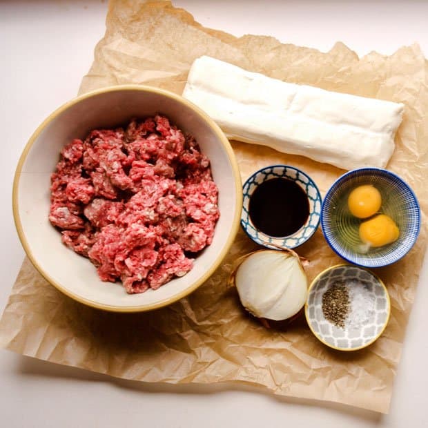 Minced beef, eggs, onion, puff pastry and seasonaing for Scottish Mince Beef Pie