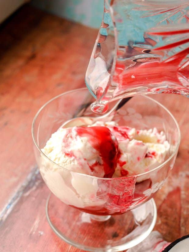 Bowl of ice Cream with sauce poured over