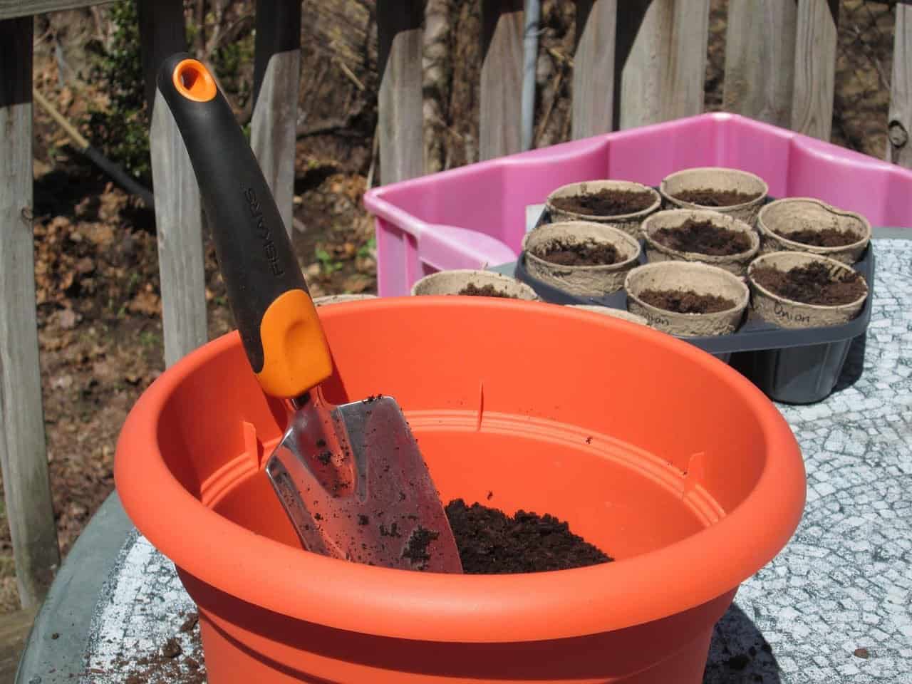 Plant pot, trowel and compost 