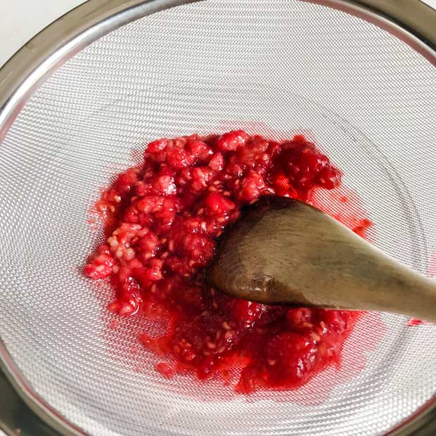 Press cooked raspberries through a sieve