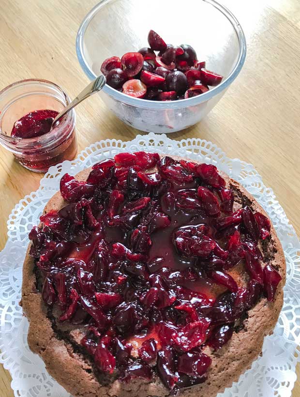 Chocolate Cherry Brownie Cake covered in cherry compote