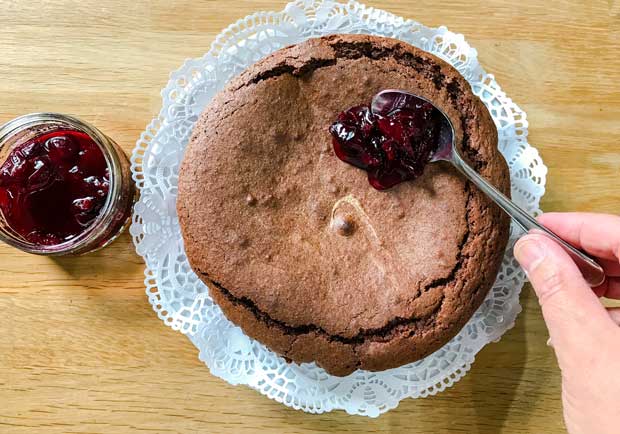 Spoon the cherry compote onto the Chocolate Brownie Cake 