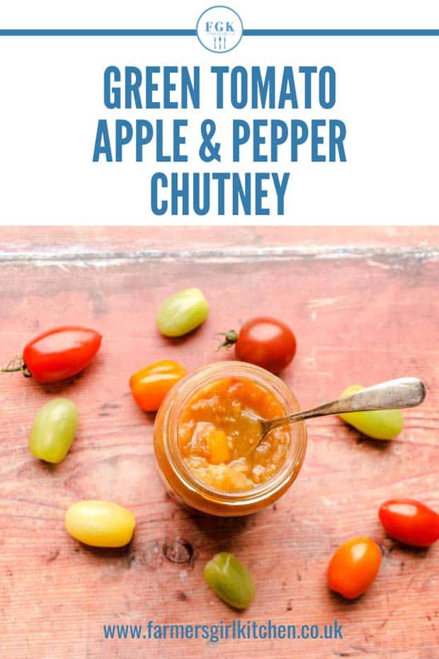 jar of Green Tomato, Apple & Pepper Chutney with spoon and tomatoes