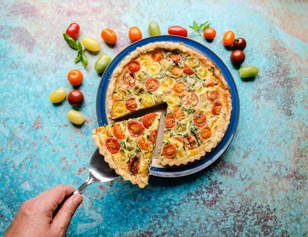 Cutting a slice of Tomato & Bacon Tart