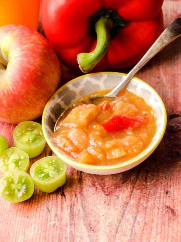 Bowl of Green Tomato Chutney with pepper, appole and tomatoes