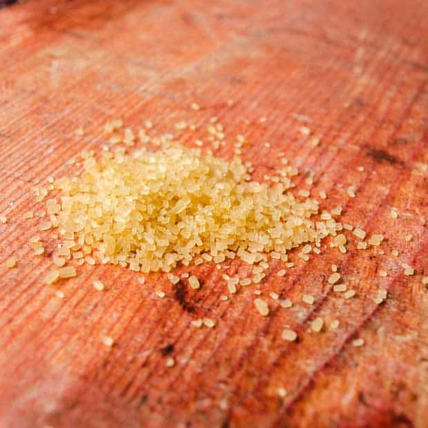 Demerara (raw) sugar on wooden board
