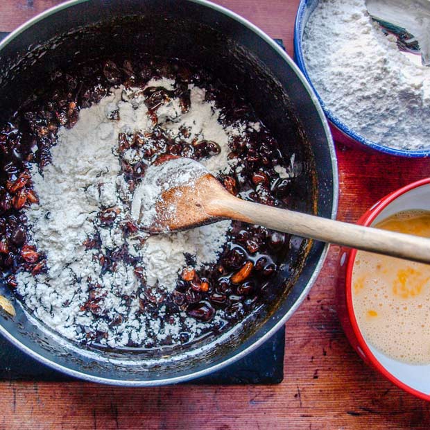 Flour added to fruit mixture in pan