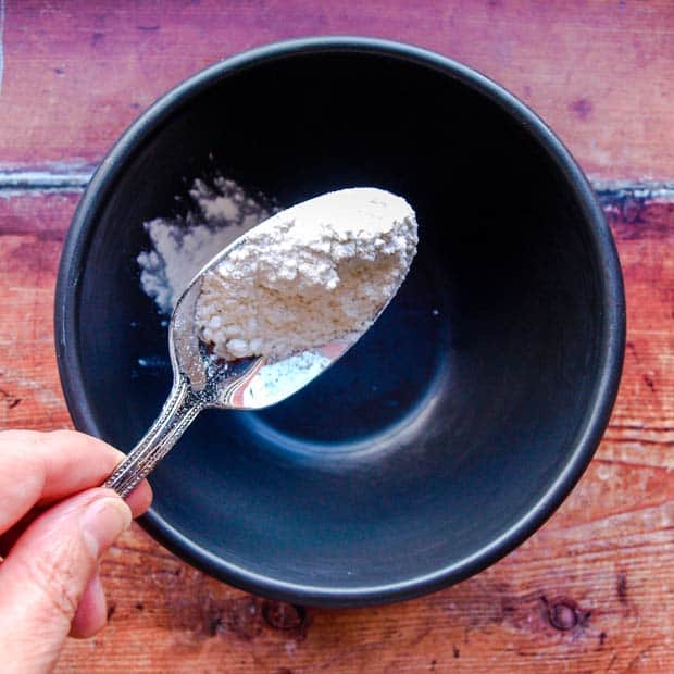 pudidng basin with spoon of flour