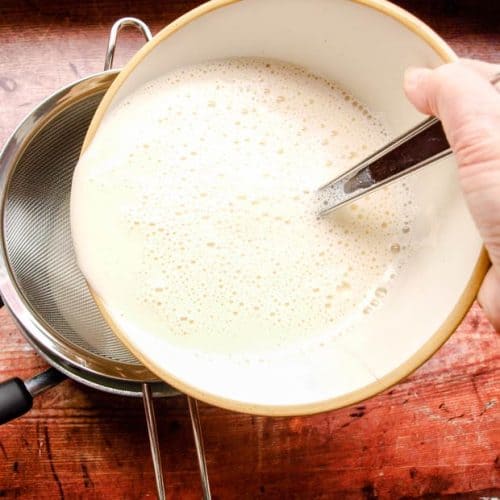 pour the custard mixcture through a seive