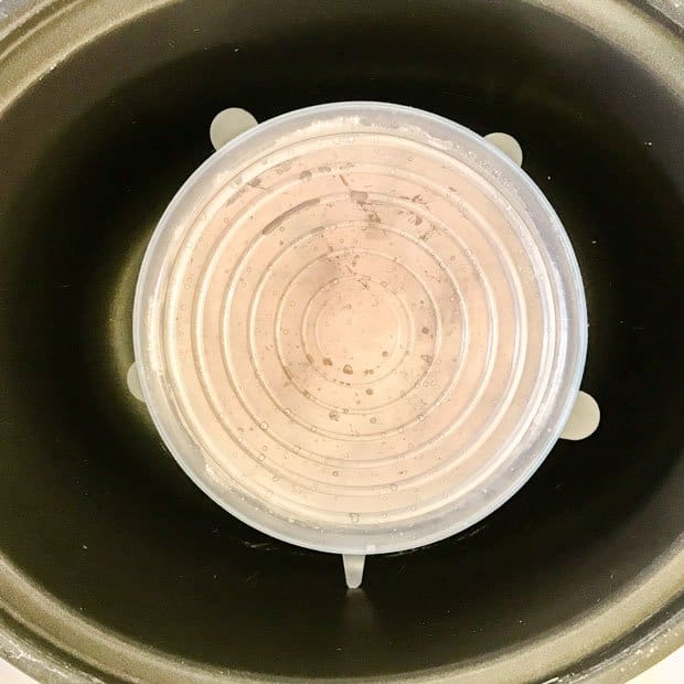 Covered pudding basin in slow cooker
