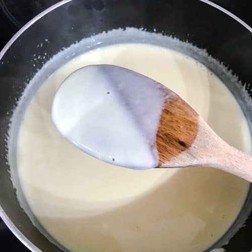 pan of custard. wooden spoon coated in custard.