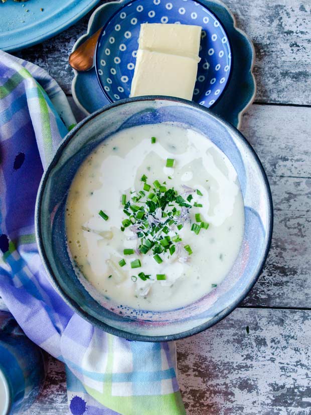 Bowl of Cullen Skink with swirl of cream and chives.