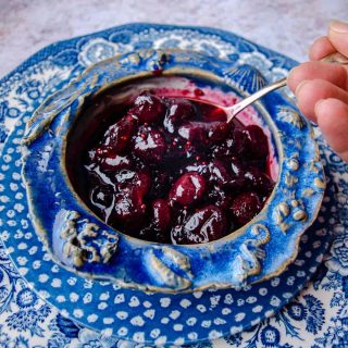 Bowl with spoon filled with Cranberry & Red Wine Sauce