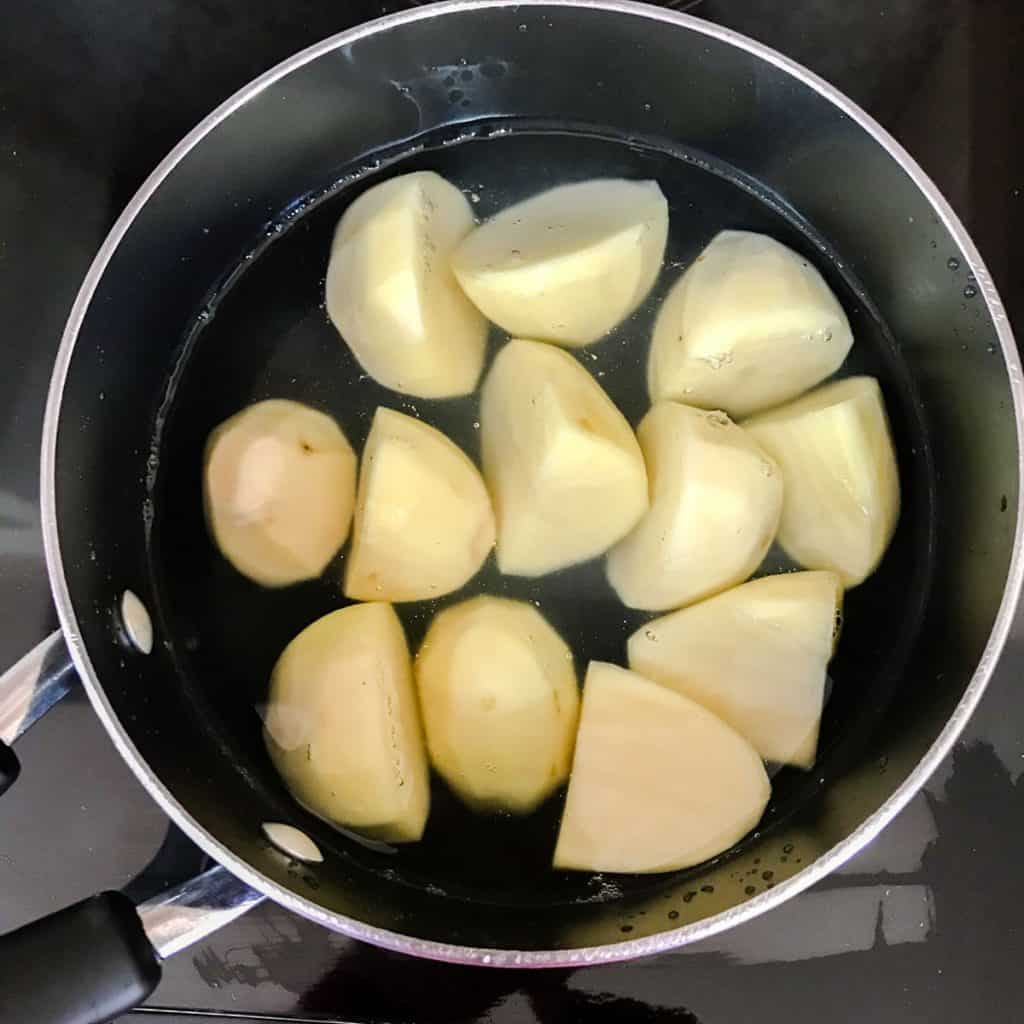 peeled potatoes in pan