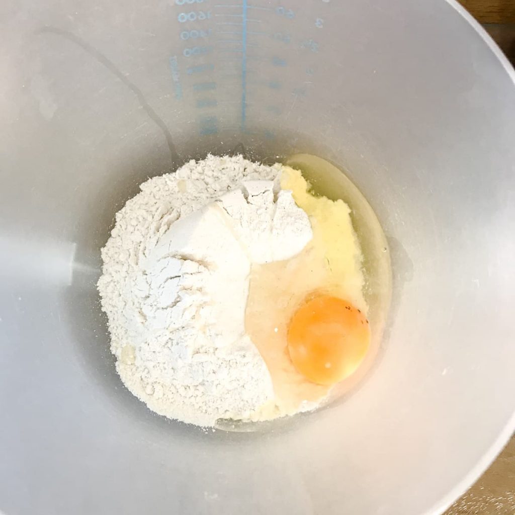 Flour and egg in bowl for Seafood Pancakes