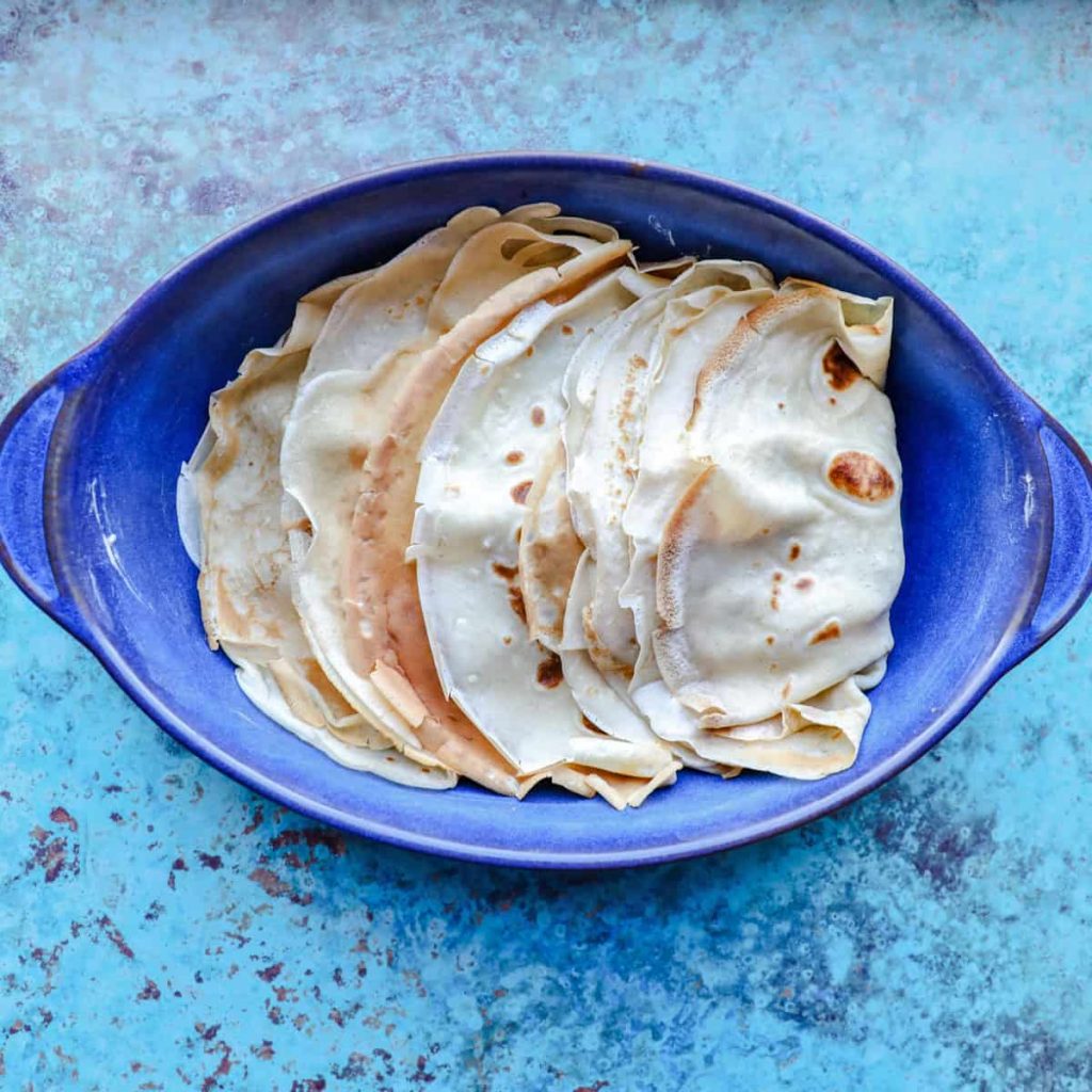 Seafood pancakes layed in baking dish