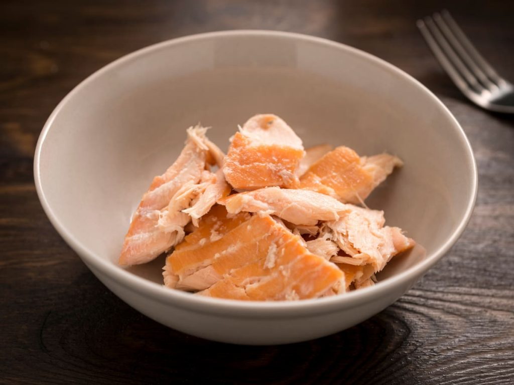 Flaked salmon in a bowl