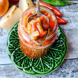 Runner Bean Chutney with Tomato & Chillis on spoon over jar
