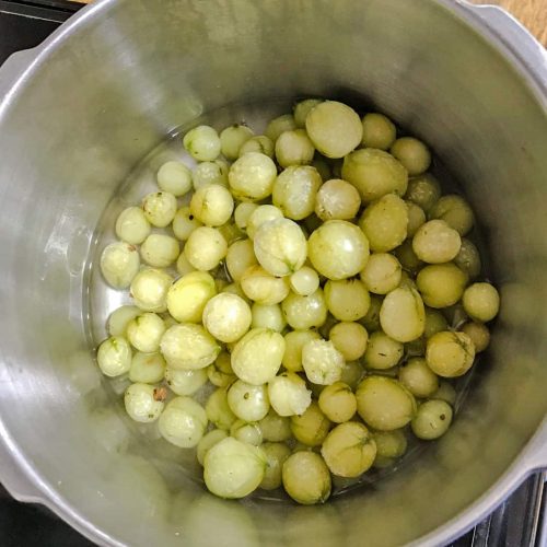 gooseberries in pan for gooseberry jam