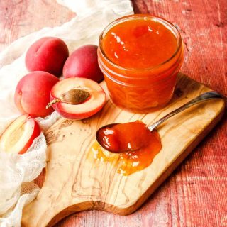Apricot Jam with apricots and spoon of jam