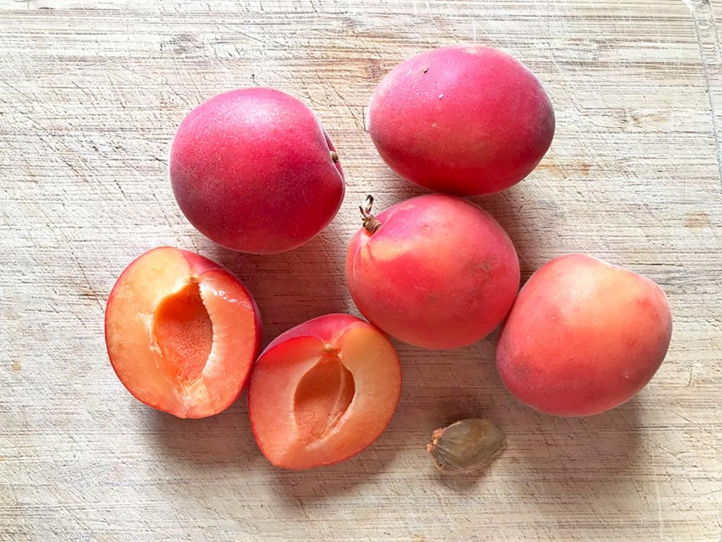 Apricots on wooden board