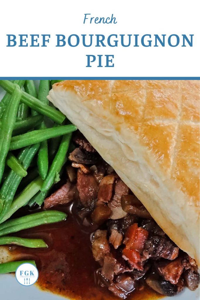 Beef Bourguignon Pie plated with green beans