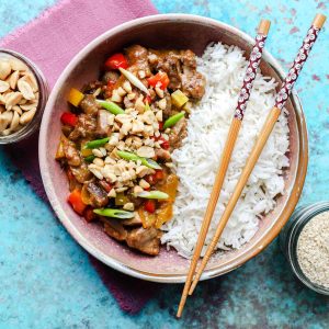 Kung Pao Chicken (Slow Cooker) in bowl with rice and chopsticks