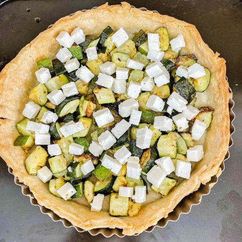 courgette and feta tart - roasted courgettes and feat cheese in baked tart shell