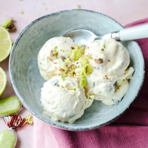 Chocolate Chip Lime ice Cream in bowl with limes and sweets