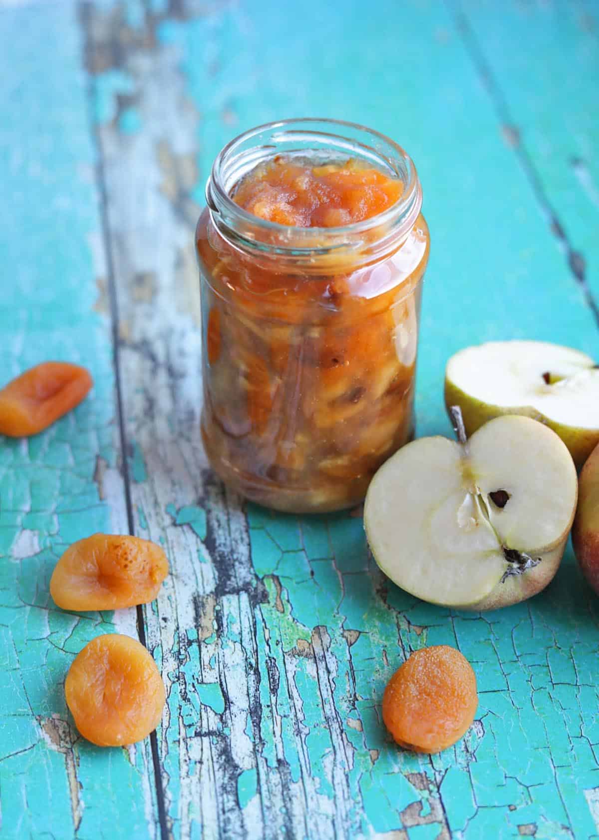 Apricot and Apple Chutney in jar with apples and dried apricot