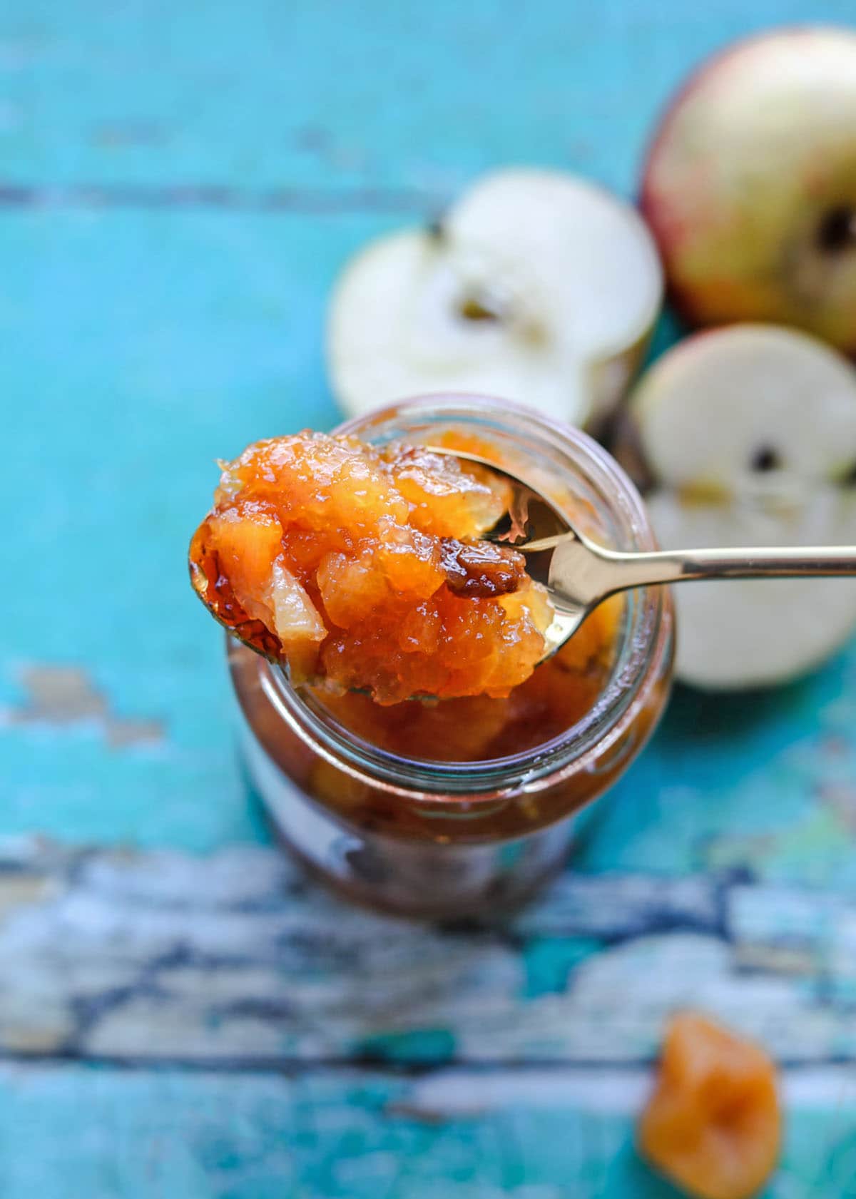 Apricot and Apple Chutney on spoon on jar