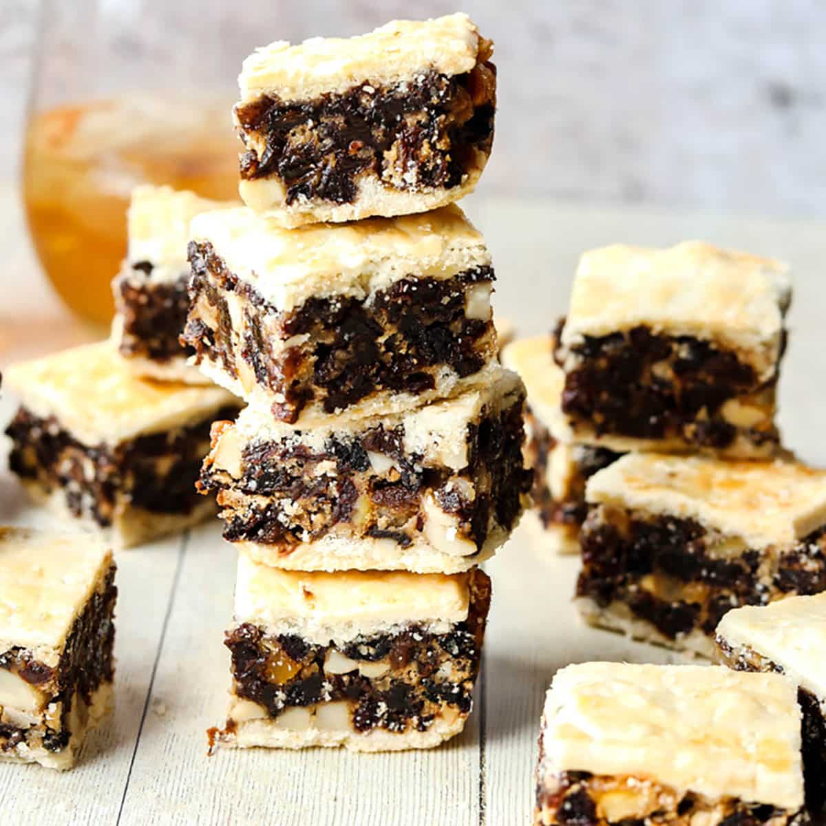 Black Bun Traybake Slice with whisky oin glass