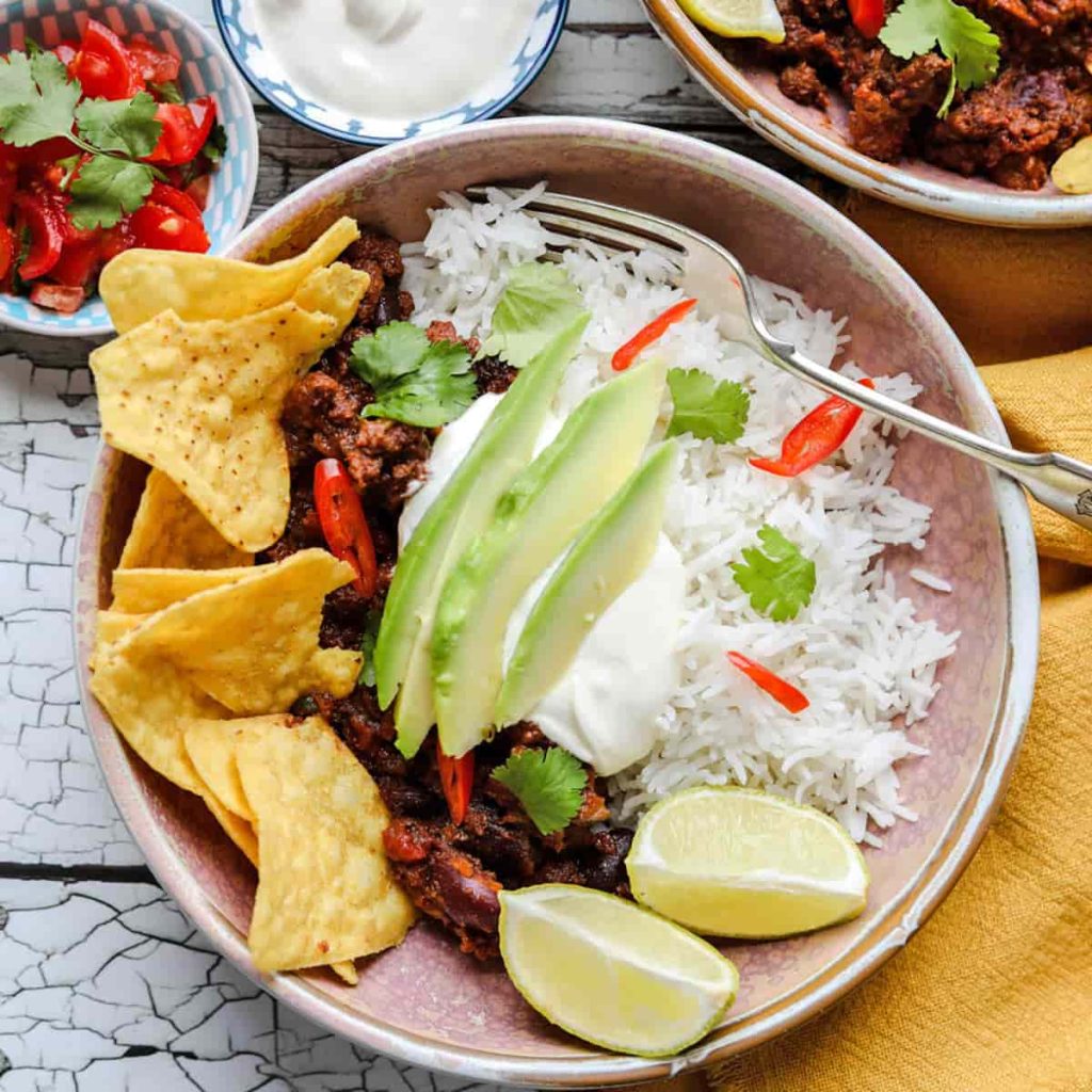Slow cooker Chilli in bowl with avocado