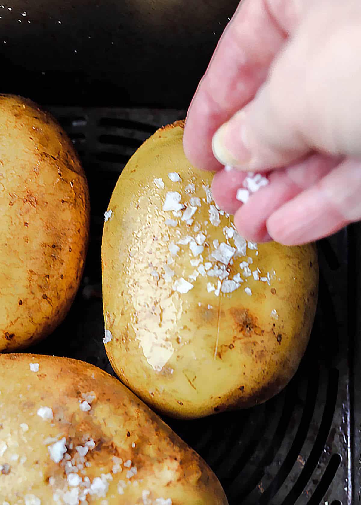 Air fryer Baked Potatoes add salt