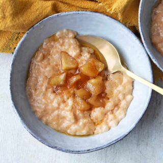 Slow Cooker Rice pudding in a bowl with butterscotch apples