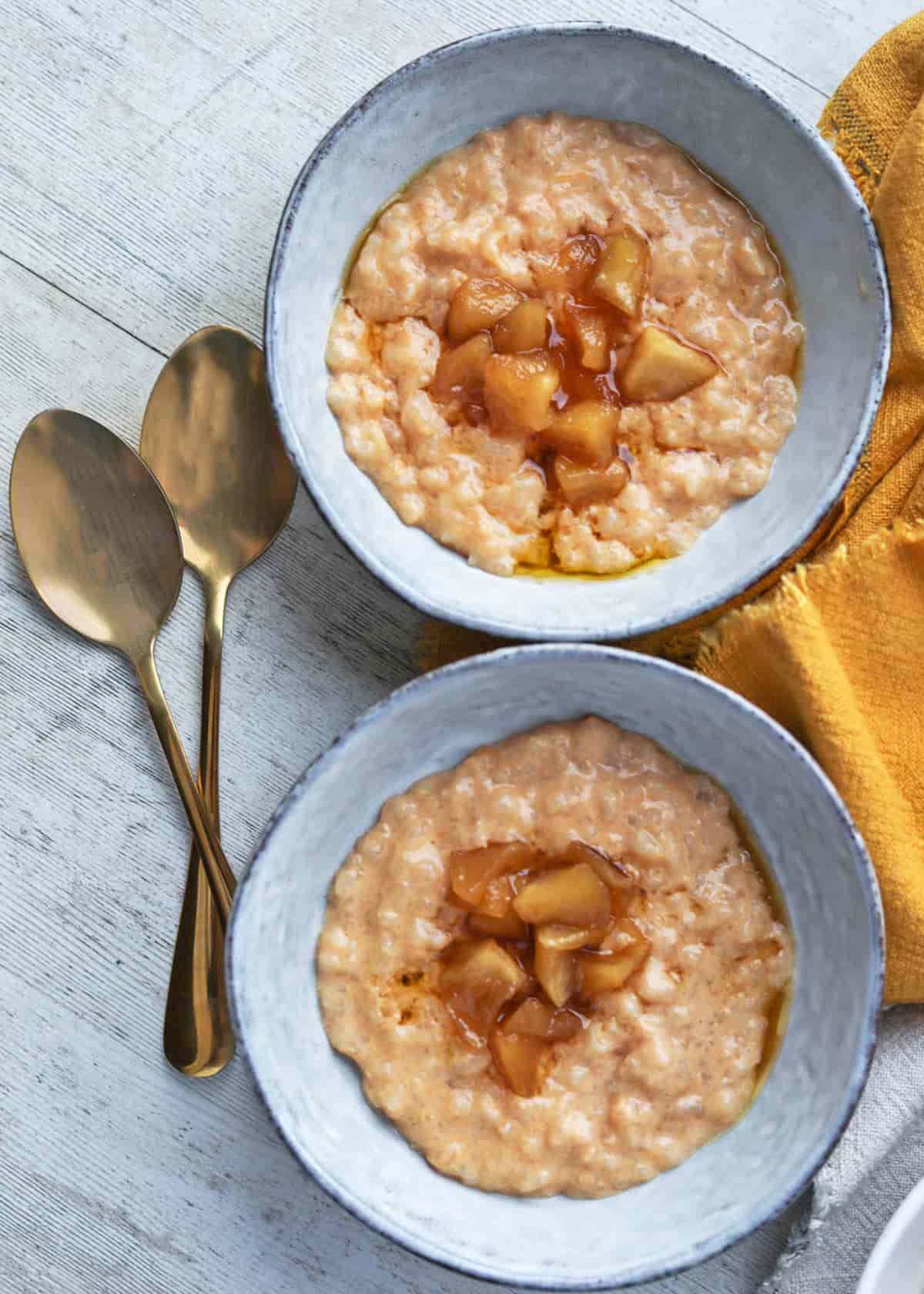 Slow Cooker Rice Pudding two plates with spoons