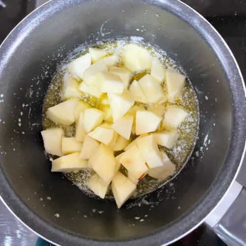 Apples in pan with butter and sugar