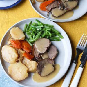 Slow Cooker Beef Pot Roast served on plate with gravy