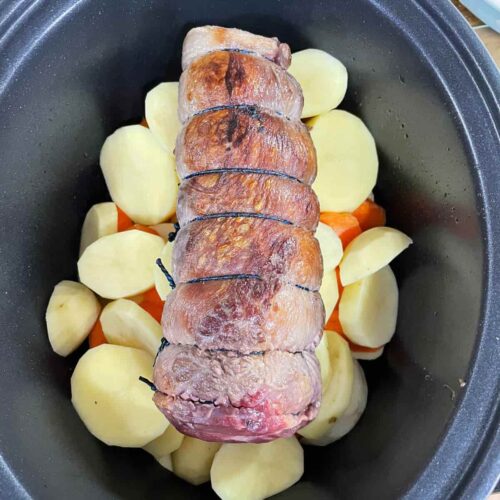 Slow Cooker Beef Pot Roast on top of vegetables