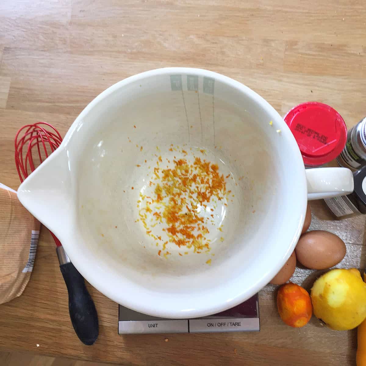 Hot cross bun waffles with orange zest in bowl