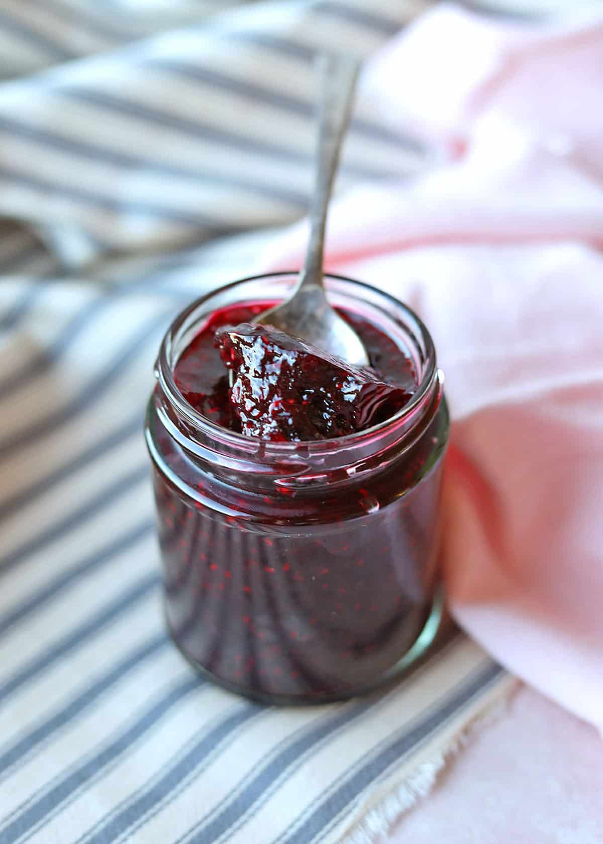 Low Sugar Blueberry & Raspberry Jamin jar with spoon