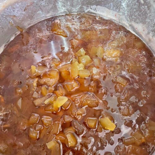 Rhubarb and Ginger Jam with preserved ginger in pan